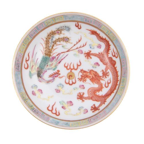 A Chinese Famille-rose and Iron-Red 'Dragon and Phoenix' Saucer (Da Qing Xuantong Nian Zhi Mark)