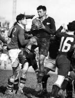 Australian second-rower Dr. Phil A. Hard400astle (left), prepares to up-end New Zealand M?ori breakaway Alan Walter 'Kiwi' Blake