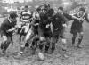 Who wants it! New Zealand Māori players ready to pounce on loose ball lost by Auckland in Muddy conditions