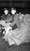 These boys sold sacks stuffed with newspaper for sixpence each