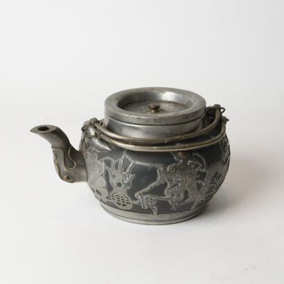 A Chinese Yixing Teapot with Pewter Mounts