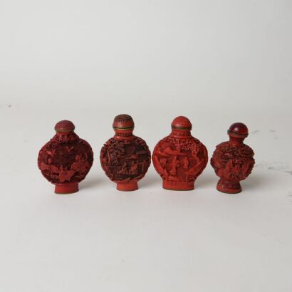 A Group of Four Chinese Red Resin Carved &lsquo;Figure and Floral&rsquo; Snuff Bottles