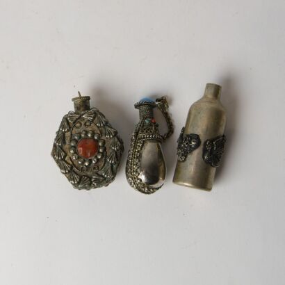 A Group of Three Chinese Silver Snuff Bottles