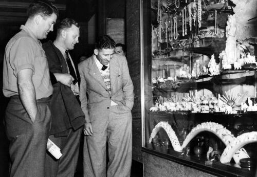 New Zealand rugby football team shopping in South Africa. D.L. Christian, R.A. Dalton and F.R. Allen (captain)