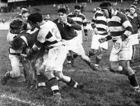 A Southland forward tires to break through but is checked by several Aucklanders. Number 16 A.R Storey (Auckland) tackling Number 15 J.T.Millar (Southland)