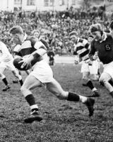 G. Gilmour (Auckland centre) breaks through