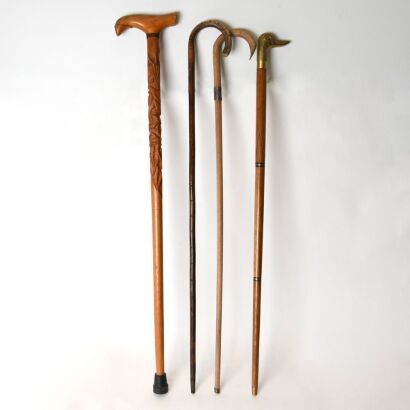 A Group of Four Wooden Walking Sticks