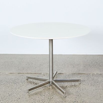 A White Circular Eames Style Table with Stainless Base