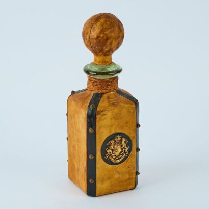 A Providentiae Memor Saxony Lion Crest Leather Wrapped Vintage Glass Bottle, Italy