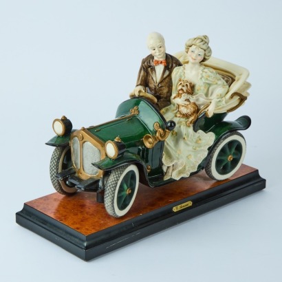 An Exquisite Large Porcelain Vintage Car with Passengers by Giuseppe Armani