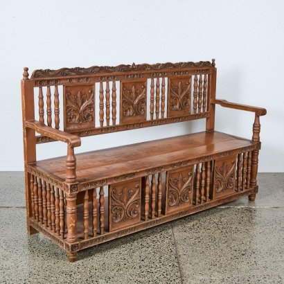 An Antique Carved Settee