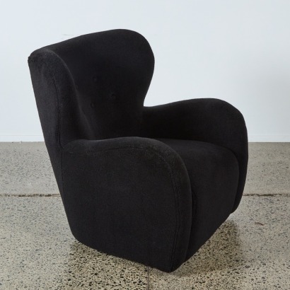 A Black Boucle Swivel Armchair