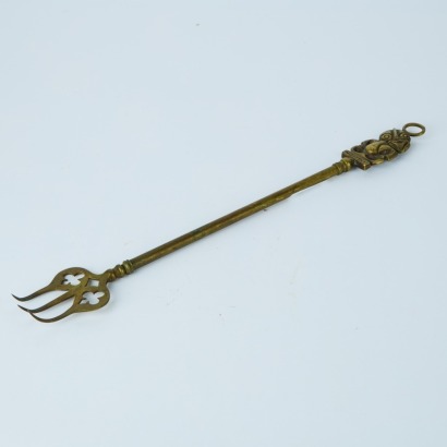 A Brass Hei Tiki Fireplace Tool