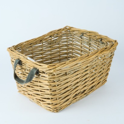 A Woven Wicker Storage Basket with Handles