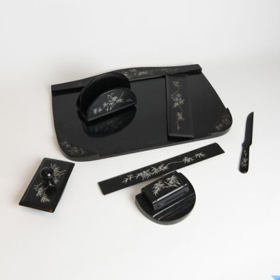 A Group of Seven Japanese Early to Mid-20th Century Black Lacquer Silver Bamboo Desk Set