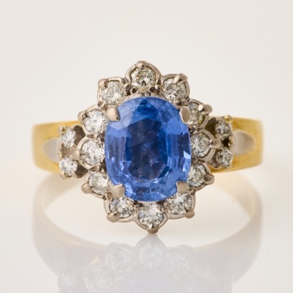 18ct Yellow Gold, 8.2mm Oval Ceylon Type Sapphire / Diamond Halo Ring