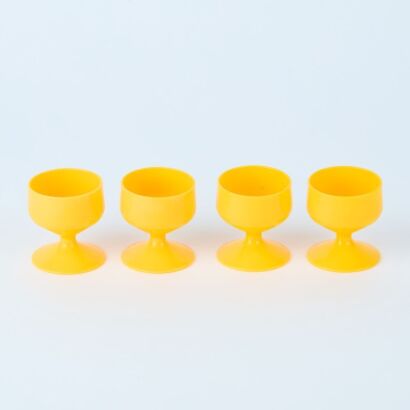 A Set of Four Yellow Egg Cups
