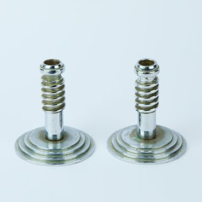 A Pair of Metal Art Deco Candlesticks
