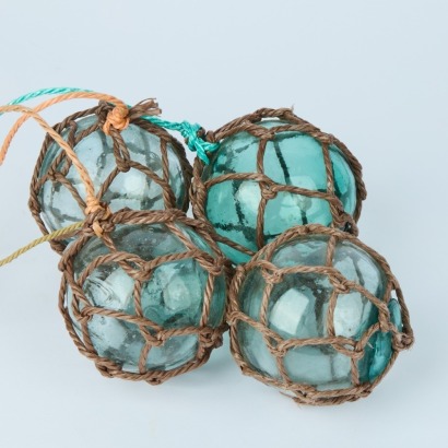 A Set of Four Japanese Glass Fishing Floats