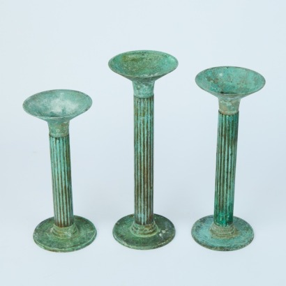 A Set of Three Rustic Pillared Candlestick Holders