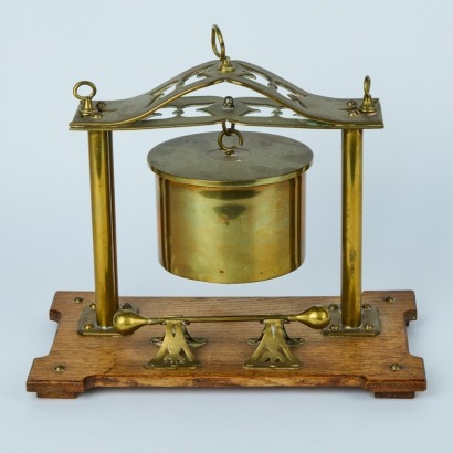 A WWI Brass Shell Dinner Gong on a Wooden Stand