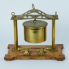 A WWI Brass Shell Dinner Gong on a Wooden Stand