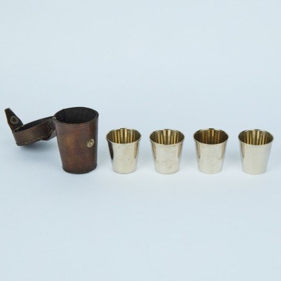 A Set of Stainless Travel Cups In A Leather Holder