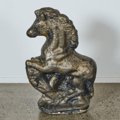 A Concrete Prancing Pony Statue