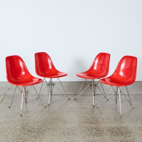 A Set of Four Fibreglass Dining Chairs by Charles and Ray Eames for Modernica