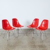 A Set of Four Fibreglass Dining Chairs by Charles and Ray Eames for Modernica