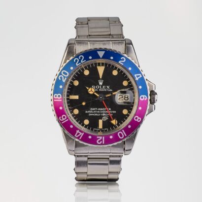A Rare, Highly Collectable, 40mm Rolex GMT Master "Fuchsia" bezel MK1 "Long E" Dial with Original Rivet Bracelet, circa 1968