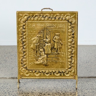 An Ornate Pressed Brass Fire Screen