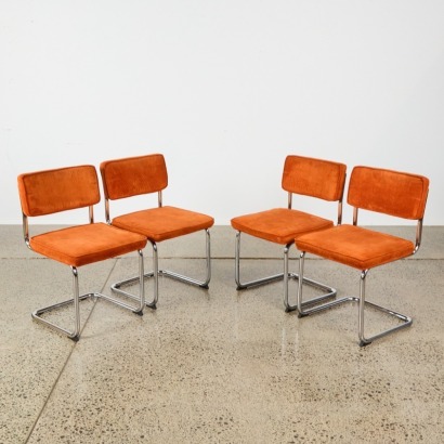 A Set of Four Orange Corduroy and Chrome Chairs