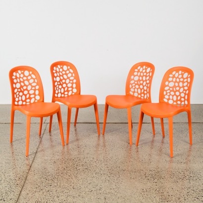 A Set of Four Moulded Chairs