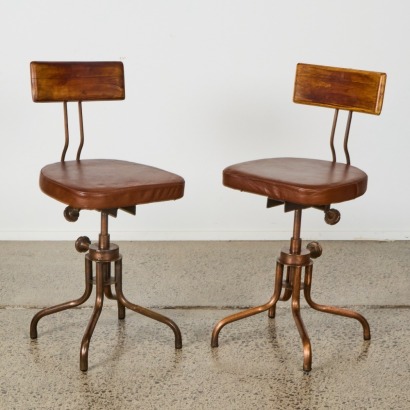 A Pair of Industrial Swivel Chairs