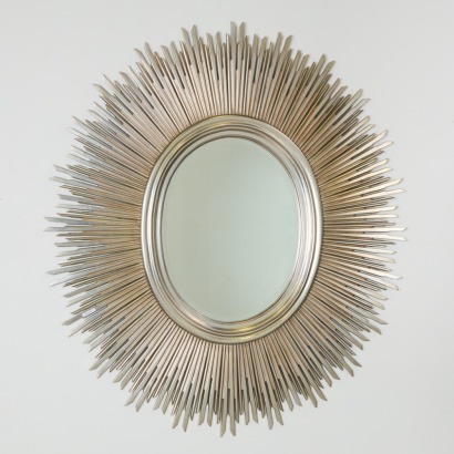 A Large Oval Sunburst Mirror