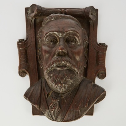 A Wood Carved Plaque of a Gentleman