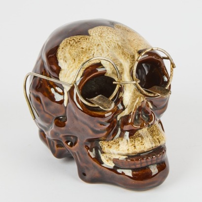 A Ceramic Smoking Skull Ashtray