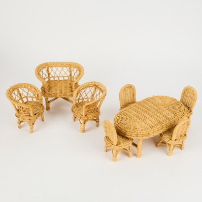 A Collection of Eight Cane Doll Chairs and Table with Basket