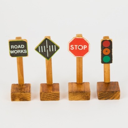 A Collection of Four Vintage Toy Road Signs