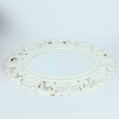 An Oval Ornate Wall Hung Mirror