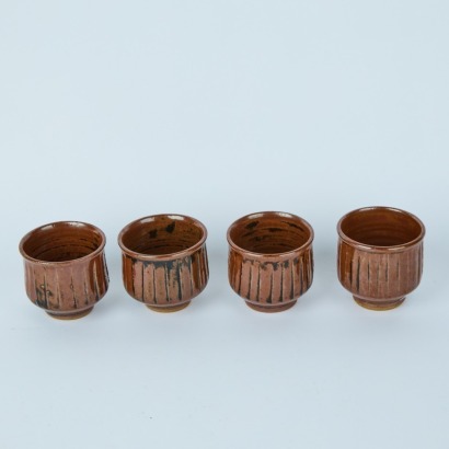 A Set of Four Incised Tea Cups