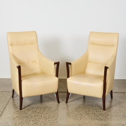 A Pair of High Back Lounge Chairs in the Style of Giorgetti