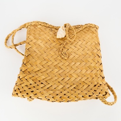 A Harakeke Backpack with Shell Clasp