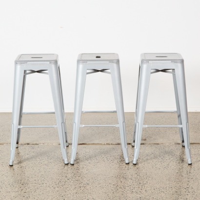 A Trio Of Metal Industrial Barstools