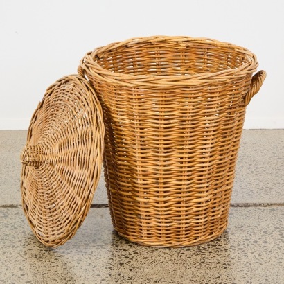 A Large Woven Wicker Storage Basket With Lid