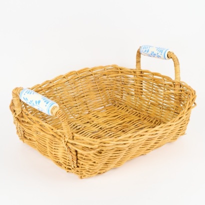 A Large Wicker Tray Basket with Ornate Ceramic Handles