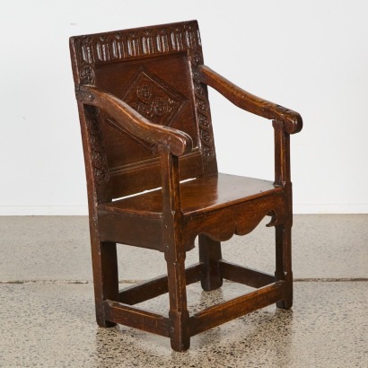 An Ornately Carved Wood Chair