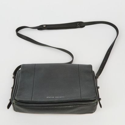 A Status Anxiety Succumb Crossbody Handbag in Black