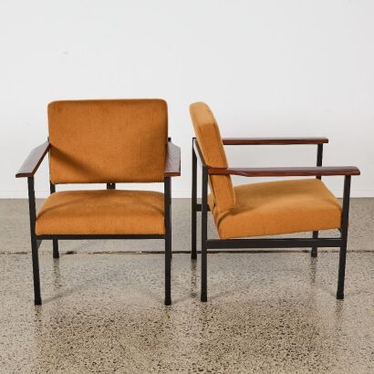 A Pair of Mid-Century Chairs With Surfboard Arms